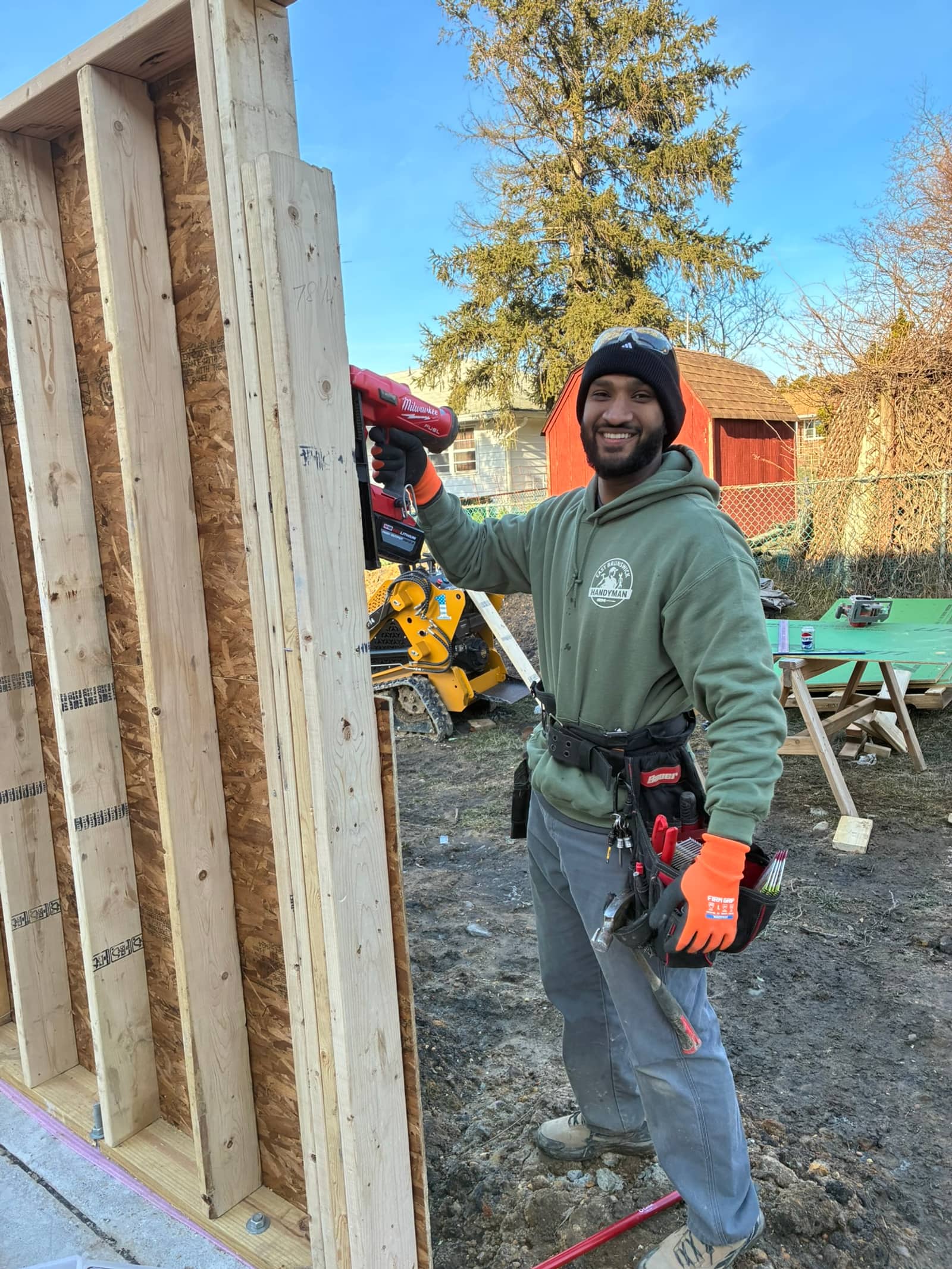 Osama, owner of Middletown Handyman, on a job site